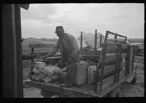 Southeast Missouri Farms. Loading truck in process of moving FSA (Farm Security Administration) client to new farm unit