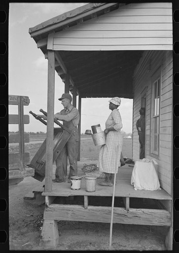 Southeast Missouri Farms. Moving (Farm Security Administration) FSA client from old home to new farm unit