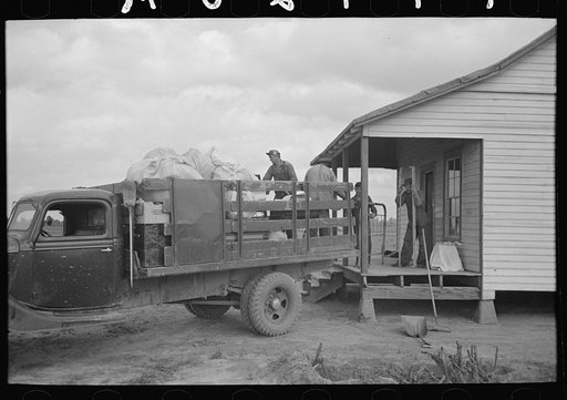 Untitled photo, possibly related to: Southeast Missouri Farms. Moving from old home to new