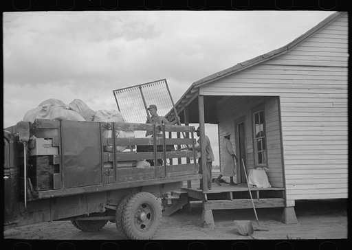 Untitled photo, possibly related to: Southeast Missouri Farms. Moving from old home to new
