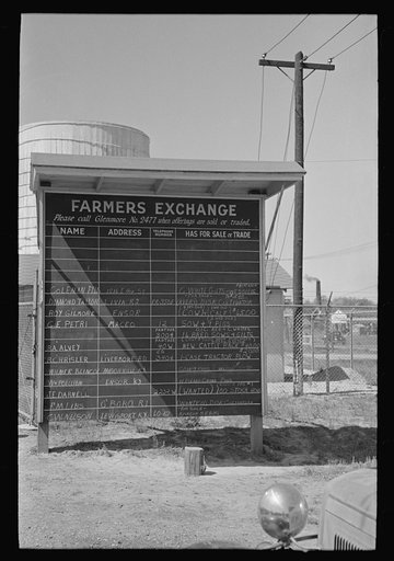 Bulletin board of farmer's exchange at liquid feeding station, Owensboro, Kentucky