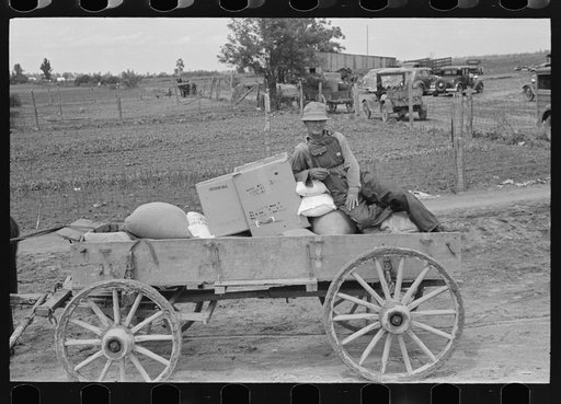 Untitled photo, possibly related to: Southeast Missouri Farms. FSA (Farm Security Administration) client sitting on load of groceries in trailer