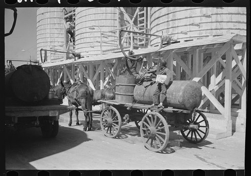 Untitled photo, possibly related to: Farmer at liquid feed loading station, Owensboro, Kentucky