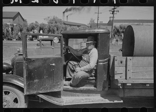 Farmer in cab of truck at liquid feed loading station at Owensboro, Kentucky