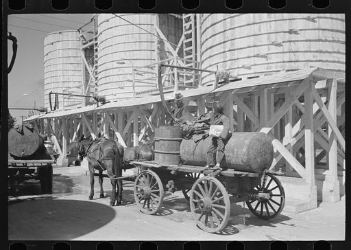 Untitled photo, possibly related to: Farmers leaving liquid feed loading station, Owensboro, Kentucky