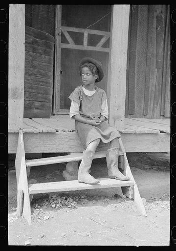 Untitled photo, possibly related to: Daughter of sharecropper on steps of front porch, New Madrid County, Missouri