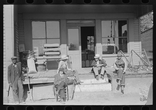 Untitled photo, possibly related to: Men in front of store at Irvington, Kentucky