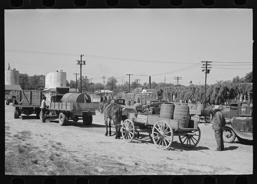 Untitled photo, possibly related to: Farmers leaving liquid feed loading station, Owensboro, Kentucky