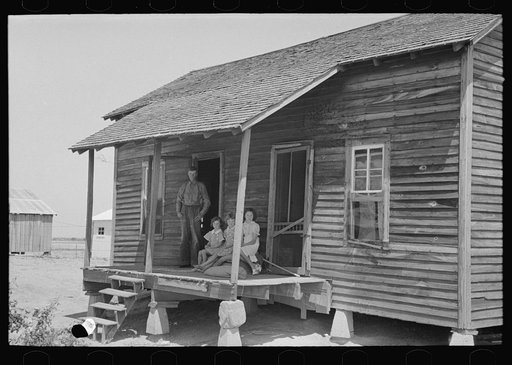 Untitled photo, possibly related to: Front porch of sharecropper cabin, Southeast Missouri Farms