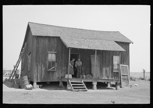 Untitled photo, possibly related to: Front porch of sharecropper cabin, Southeast Missouri Farms