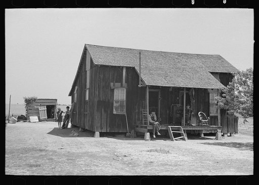 Untitled photo, possibly related to: Front porch of sharecropper cabin, Southeast Missouri Farms
