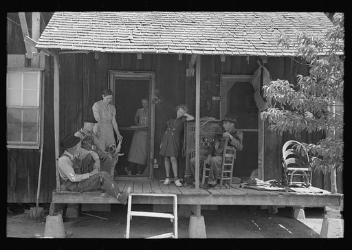Untitled photo, possibly related to: Family of sharecropper on front porch, Southeast Missouri Farms