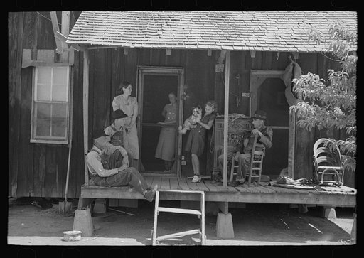 Family of sharecropper on front porch, Southeast Missouri Farms