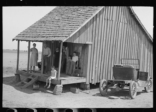 Untitled photo, possibly related to: Family of sharecropper on front porch, Southeast Missouri Farms