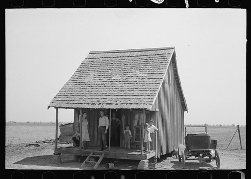 Untitled photo, possibly related to: Family of sharecropper on front porch, Southeast Missouri Farms