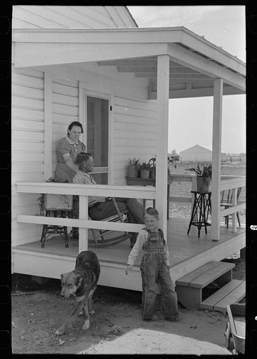 Untitled photo, possibly related to: Southeast Missouri Farms. Family of FSA (Farm Security Administration) client, former tenant farmer, on front porch of new home
