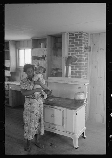 Untitled photo, possibly related to: Southeast Missouri Farms. FSA (Farm Security Administration) clients preparing greens for canning