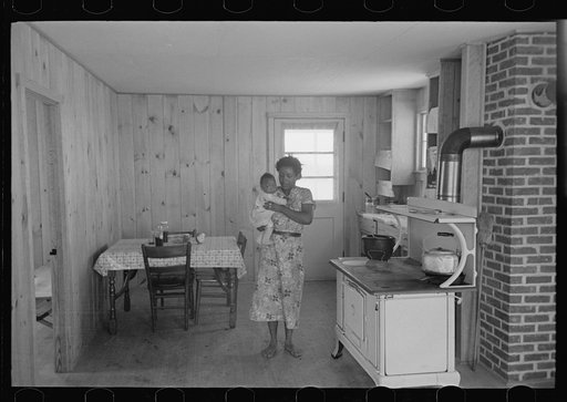 Untitled photo, possibly related to: Southeast Missouri Farms. FSA (Farm Security Administration) clients preparing greens for canning