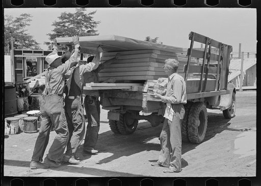 Delivery of materials. The standard house load being checked before leaving the yard. Southeast Missouri Farms Project