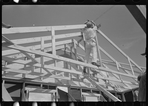 Southeast Missouri Farms Project. House erection. Shop assembled trusses are raised in place by regular erection crew of five men. No scaffolding is necessary for this operation