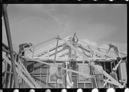 Southeast Missouri Farms.  Putting trusses of house in place