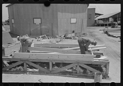 Porch plant. Placing joists in floor frames. Southeast Missouri Farms Project