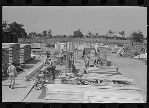 Untitled photo, possibly related to: House plant. Gasoline saw being adjusted for ripping purposes. Southeast Missouri Farms Project
