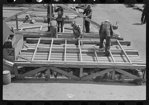 Untitled photo, possibly related to: House plant. Wall panels are framed on table in foreground and then stacked ready for finishing. Southeast Missouri Farms Project
