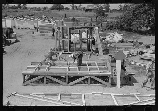 House plant. Window insert being placed in a wall panel. Southeast Missouri Farms Project