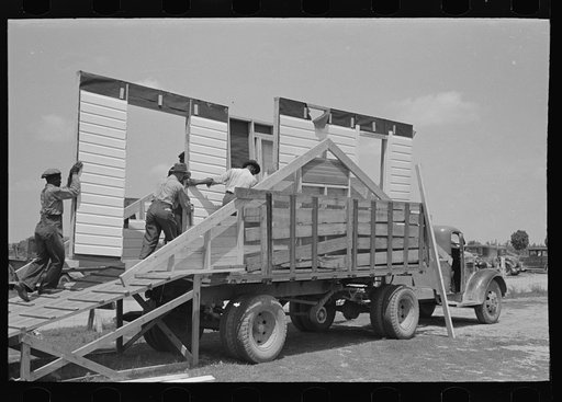 Untitled photo, possibly related to: House plant. Completed panel being moved to the stacks. Southeast Missouri Farms Project