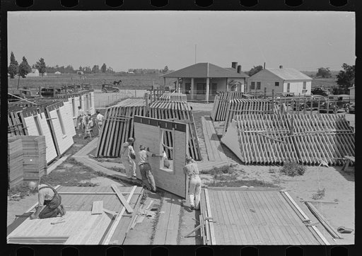 Housing plant. Moving completely assembled panel to stacks. Southeast Missouri Farms Project