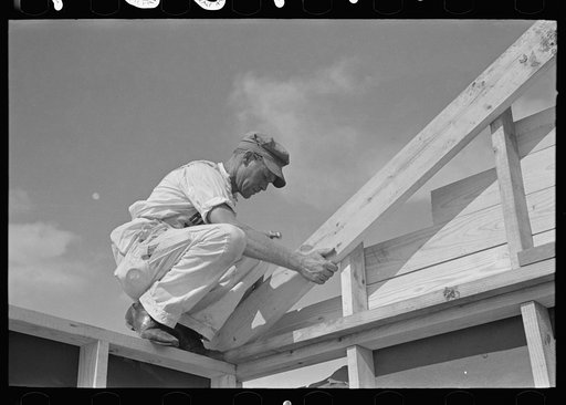 Southeast Missouri Farms Project. House erection. Fastening gable end in place