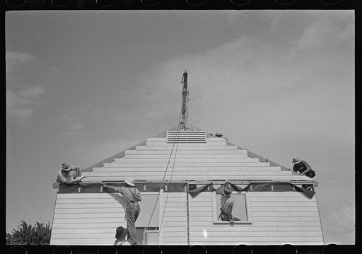 Untitled photo, possibly related to: Southeast Missouri Farms. Erecting gable end on house