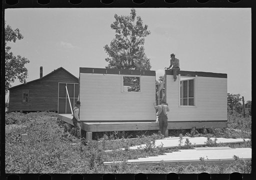 Untitled photo, possibly related to: Southeast Missouri Farms Project. House erection. Roofing over shingle lath with wood shingles