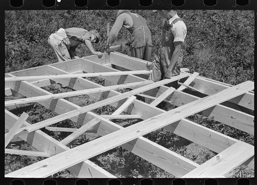 House erection. Checking square of floor frame system. Southeast Missouri Farms Project
