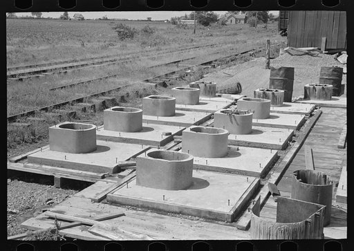 Untitled photo, possibly related to: Privy plant. Sanitary pre-cast concrete privy bases after stripping of forms. Southeast Missouri Farms Project