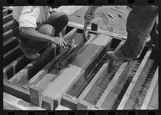 Privy plant. Placing reinforcing mesh in mud sills. Southeast Missouri Farms Project