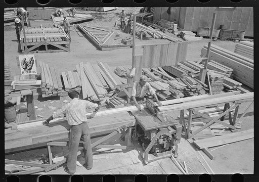 House plant. Precutting materials by gasoline saw. There was no electric power available. Southeast Missouri Farms Project