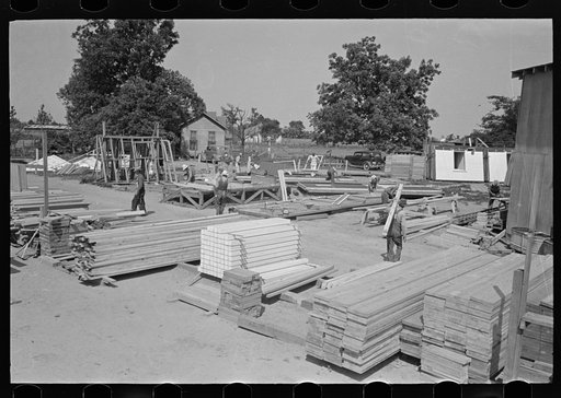 Untitled photo, possibly related to: House plant. Precutting materials by gasoline saw. There was no electric power available. Southeast Missouri Farms Project