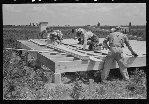 Untitled photo, possibly related to: House erection. Laying subfloor. Southeast Missouri Farms Project