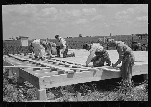 House erection. Laying subfloor. Southeast Missouri Farms Project