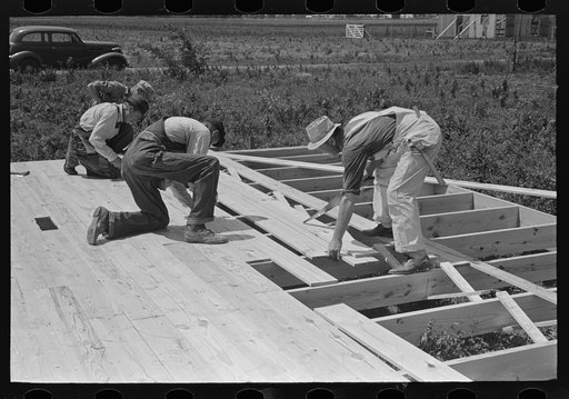House erection. Laying subfloor. Southeast Missouri Farms Project