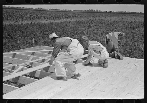 House erection. Laying subfloor. Southeast Missouri Farms Project