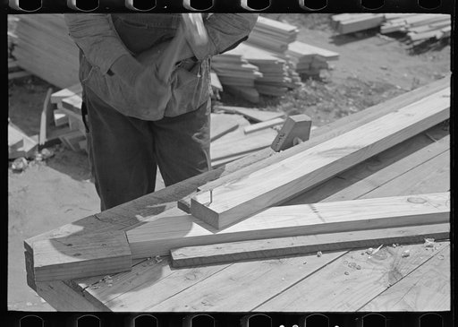 Untitled photo, possibly related to: Food storage plant. Placing precut rafters in jig for making trusses. Southeast Missouri Farms Project