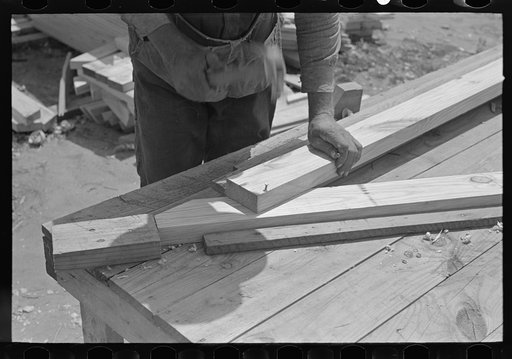 Untitled photo, possibly related to: Food storage plant. Placing precut rafters in jig for making trusses. Southeast Missouri Farms Project