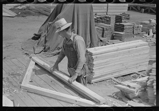 Untitled photo, possibly related to: Food storage plant. Placing precut rafters in jig for making trusses. Southeast Missouri Farms Project