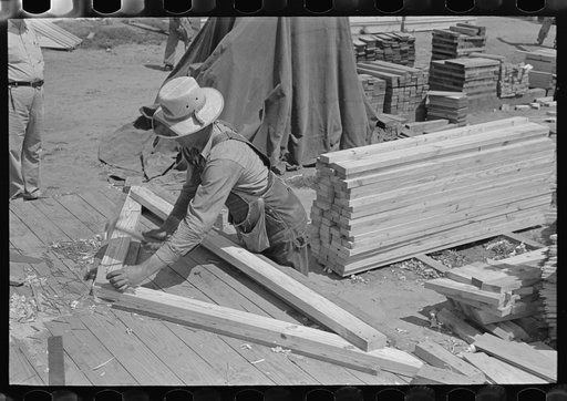 Food storage plant. Assembling trusses in wood jig. Southeast Missouri Farms Project