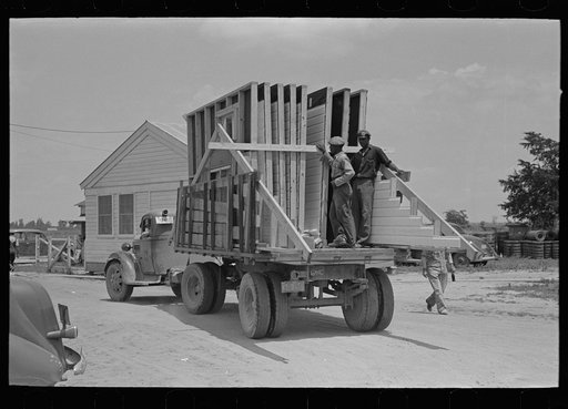 Untitled photo, possibly related to: House erection. Delivery of materials. Completed standard load of shop assembled panels. Southeast Missouri Farms Project