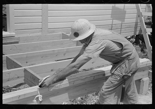 Southeast Missouri Farms Project. Setting porch floors in the field