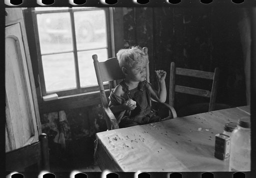 Untitled photo, possibly related to: Sharecropper family on front porch of cabin, Southeast Missouri Farms